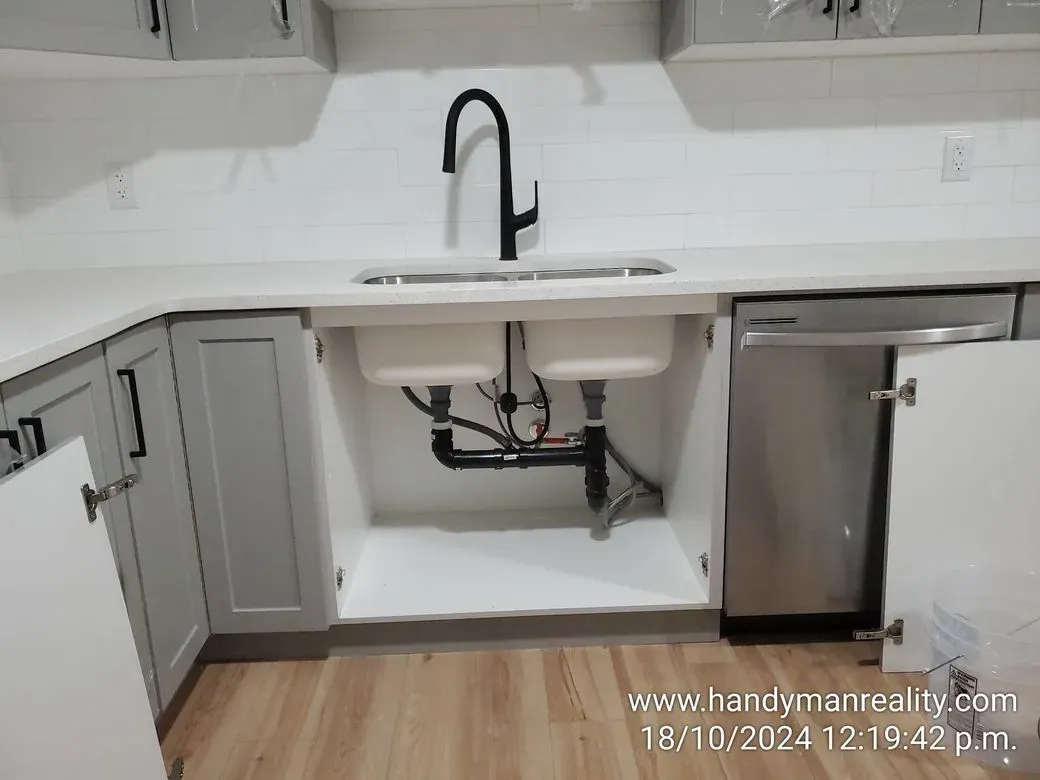 New kitchen faucet and sink, plumbing tidied underneath